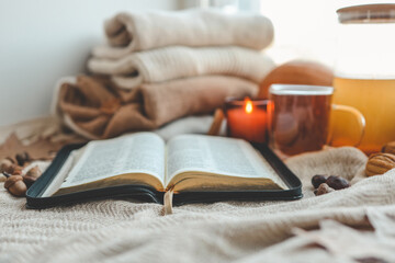 Open bible in autumn interior, good morning