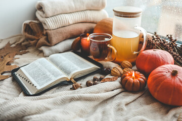 Fototapeta na wymiar Open bible in autumn interior, good morning