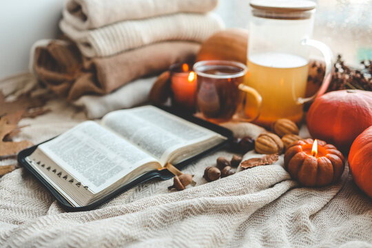 Open bible in autumn interior, good morning