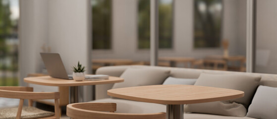 A copy space on a wooden table in a cosy contemporary coffee shop or cafe with a comfortable couch.