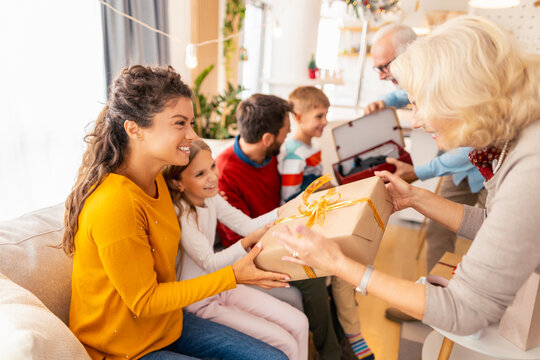 Family exchanging Christmas gifts