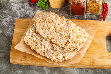 Breaded raw breaded meat schnitzel