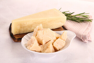 Chopped Italian hard parmesan cheese