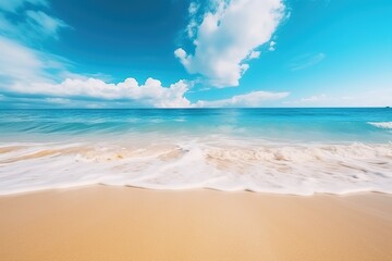 Fototapeta na wymiar Tropical summer beach background with golden sand, turquoise ocean and blue sky with white clouds