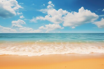 Fototapeta na wymiar Tropical summer beach background with golden sand, turquoise ocean and blue sky with white clouds