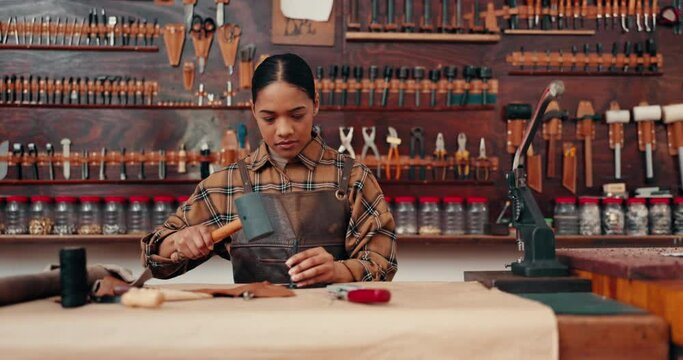 Leather work, woman in workshop with tools and craft manufacturing of unique textile product. Hammer, fabric and craftsman at tannery factory with pattern, service and repair process with texture.