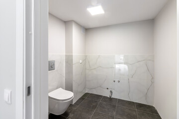 Fototapeta na wymiar Bathroom in a modern house with black ceramic tiles on the floor