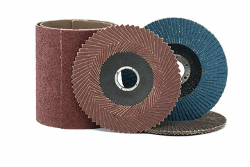 Abrasive sanding discs and sandpaper over white