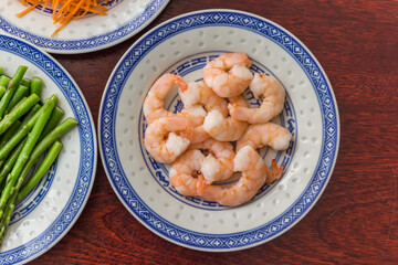Prawns and vegetables on chinese plates