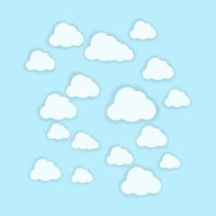 The blue background has many white clouds floating on the trees. The air is clear