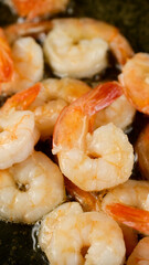 Fresh shrimps fried in oil pan, close up