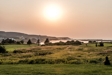Fototapeta premium Stunning Sunset panoramic view Cape Breton Island Coast line cliff Cabot Trail route, Nova Scotia Highlands Canada