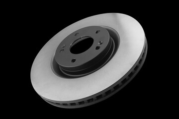 Car brake disc isolated on black background. Auto spare parts. Perforated brake disc rotor isolated...