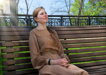 Pretty girl sitting on the bench