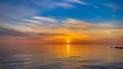Calm sea with sunset sky In Sochi