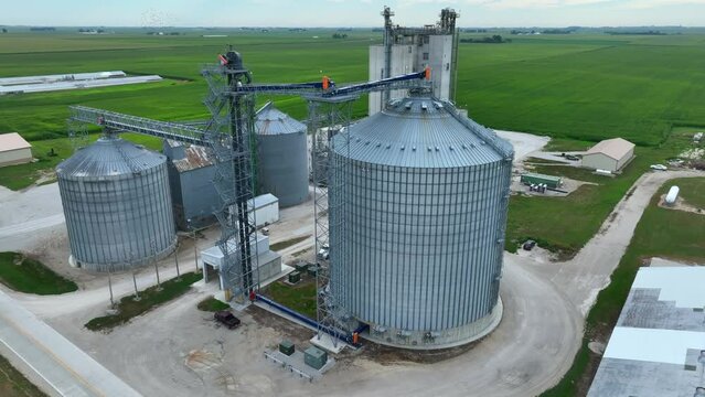 Grain elevator and ethanol plant in Midwest USA. Aerial orbit in summer.