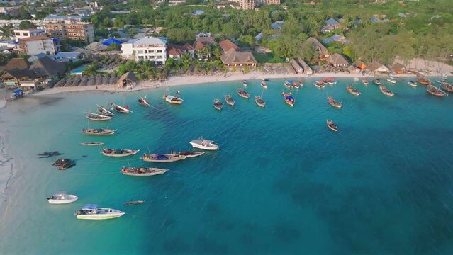 Aerial view of sandy beach with boats and people background,,Kendwa village, Zanzibar, Tanzania