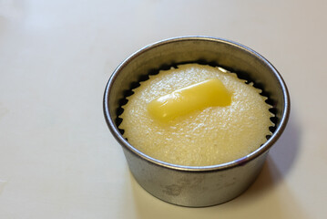 Puto cupcake in an aluminum mold.  Hulmahan ng puto. 