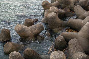 Photo of breakwaters. Coastline background
