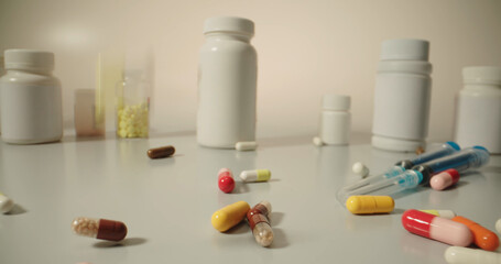 Different tablets. Copy space. The concept of medicine, disease, health. Colorful pills and tablets falling on white table with different types of drugs, pharmaceutical industry concept