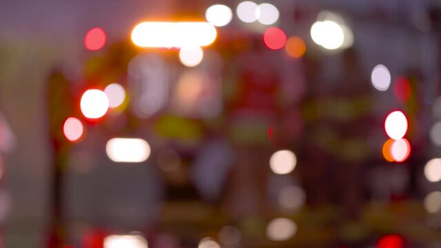 Intentionally blurred emergency services lights flashing, rescue services, fire department, flashing lights. 4K 24FPS