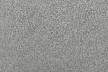 Genuine light gray leather, eco friendly leatherette texture background. Material for upholstery and interior design, sport items and clothes. Wallpaper, banner, backdrop.