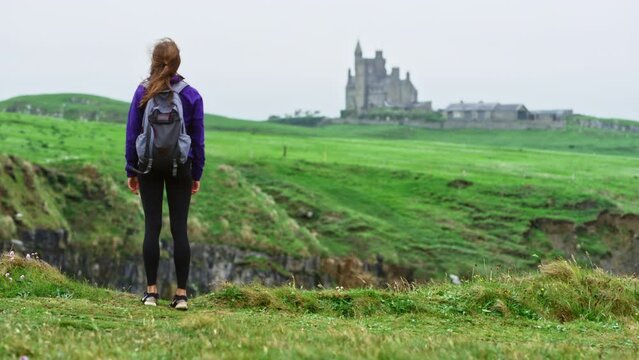 Woman Staring At Classiebawn Castle In Ireland