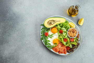 Ketogenic diet breakfast vegetables salad, avocado, fish, eggs, nuts with bulletproof keto coffee. place for text, top view