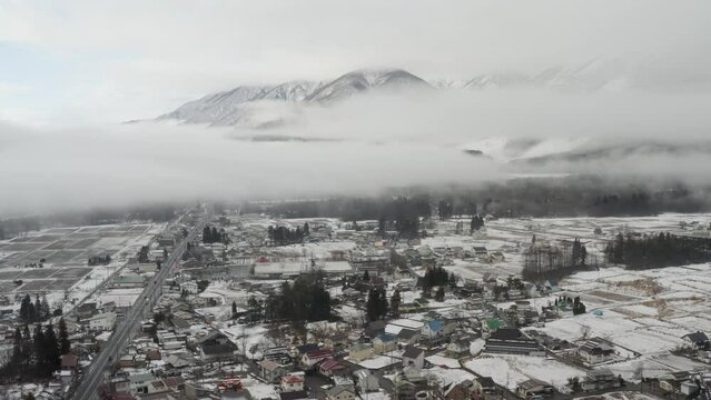 First Snowfall Over Hakuba Valley- Aerial Views Through Early Winter Clouds in Japan