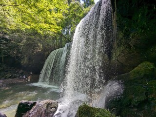 The Nabegataki Falls, where travelers can access the large cavern behind the falls