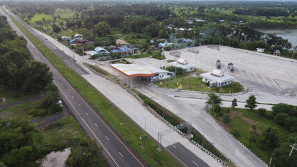 Aerial view of green fields and farmlands in rural Thailand.