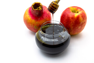 Honey , apple  and pomegranate jewish traditional symbols .Shofar , apple and pomegranate on white background. Rosh Hashanah (Jewish New Year) and Yom Kippur celebration