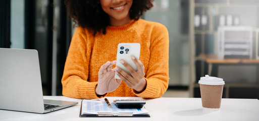 Successful Businesswoman Analyzing Finance on Tablet and Laptop at Office Desk tax, report, accounting, statistics, and analytical research concept