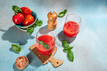 Tomato juice in a glass and fresh tomatoes. organic healthy products. Detox and clean diet concept. place for text, top view