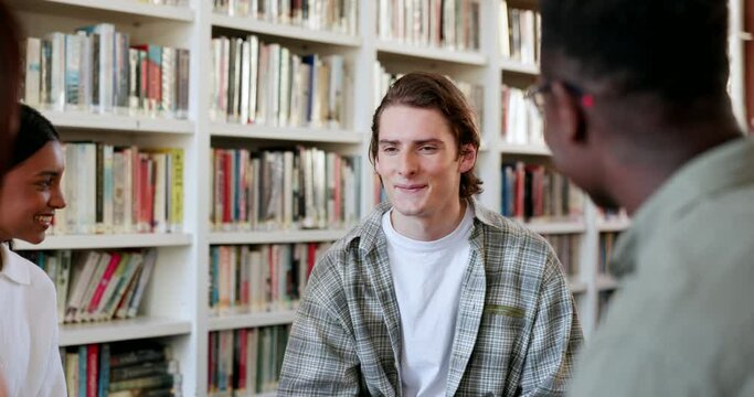 Library, students and man with education, university and study group for college project. Learning, school and conversation with studying talk and teamwork for collaboration with research tutor