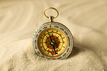 Fototapeta na wymiar Sea travel concept. Vintage compass on the sand