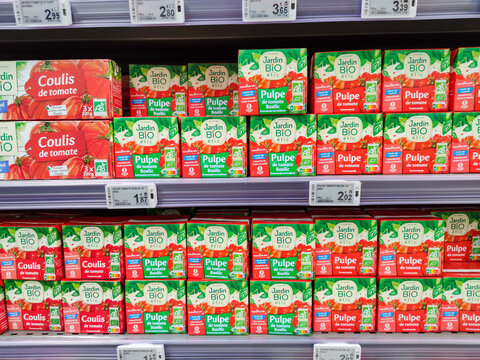 Row of Organic Tomato pulp boxes by"Jardin bio" French brand, on French Supermarket Shelf