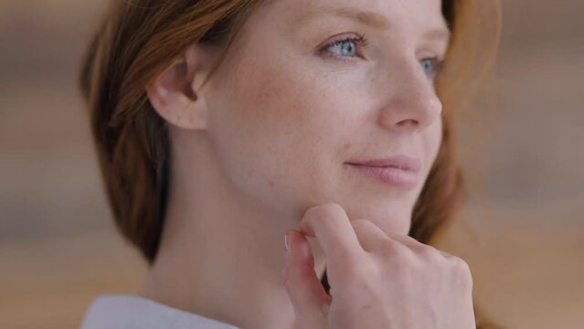 Captivating redhead lost in thought