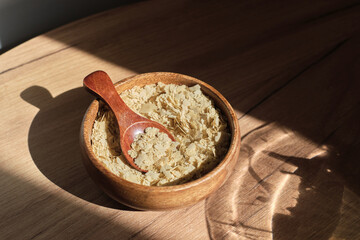 gently adds nutritional yeast to a colorful salad, enriching it with protein and B-vitamins. A go-to for sunny, health-conscious afternoons