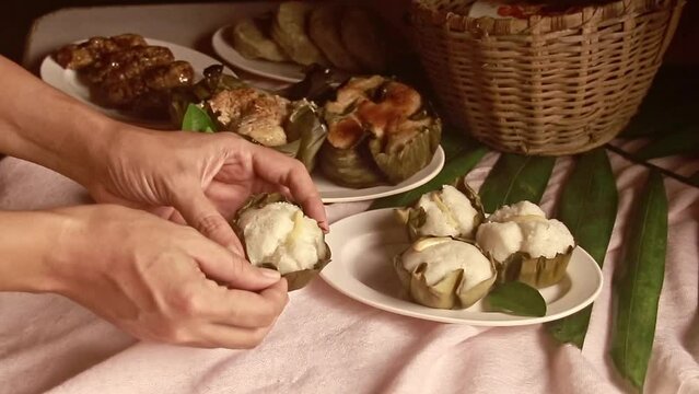 Taking a bite out of a puto or Filipino steamed rice cake, authentic traditional snack from the Philippines