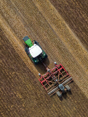 Aerial View - Farm Vehicle working on farmland in North Yorkshire in northeast England.