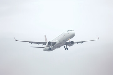 A white aircraft glides through the sky against a spotless white background, presented in a minimalist, hyper-realistic style as it soars through the air. Generative AI.