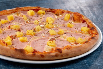 fresh pizza on the white plate