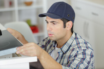 man fixing ink-jet supply system