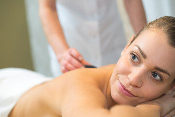Fototapeta na wymiar stone therapy hot stone massage