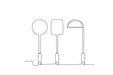 Two spatulas and a vegetable spoon. Cooking and kitchen tools one-line drawing