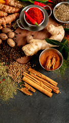 Spices on dark background. Different varius.