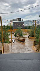 wooden boat, wooden floors, creative space, garlands, photos