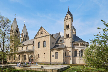 View of the Basilica of St. Castor and its gardens in Cologne, Germany.