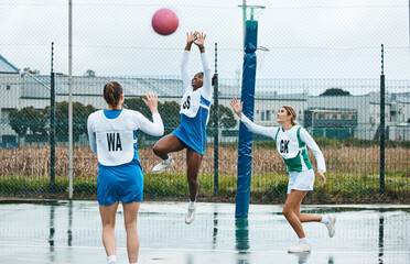 Netball, sports team and woman jump for ball, practice and playing game, court challenge or high...